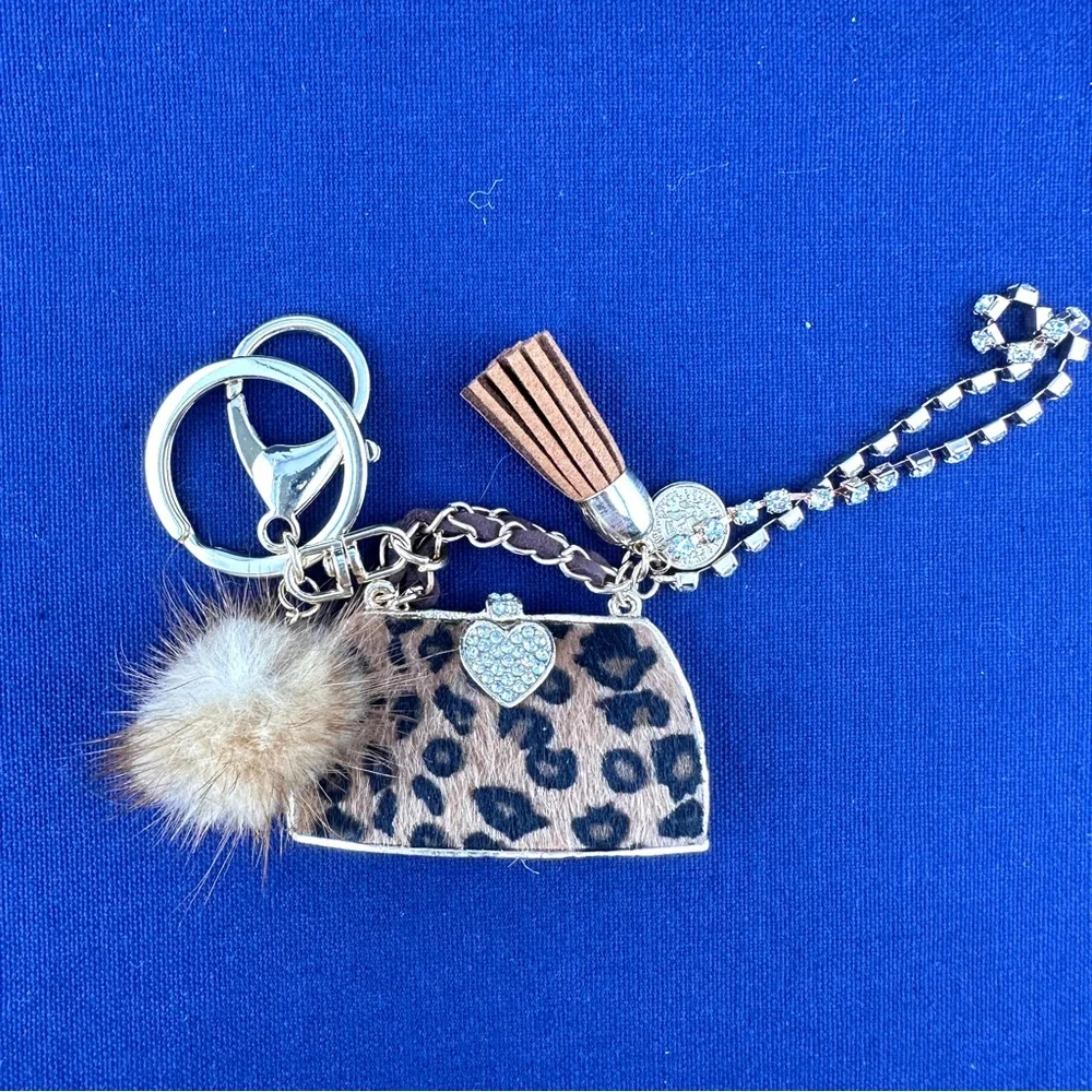 Unbranded keychain or purse charm. White, tan and black. NEW